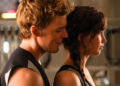 'Hunger Games' First Look: Katniss And Finnick Get Cozy In 'Catching Fire'